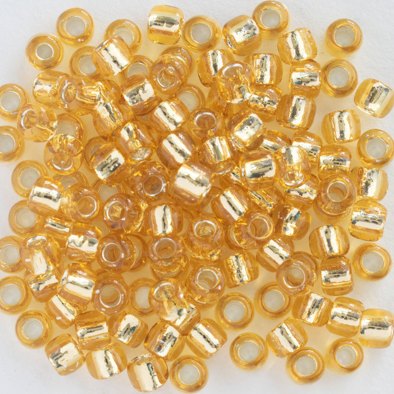 Toho Round Seed Beads Size 6/0 4mm, 22 Silver-Lined Light Topaz