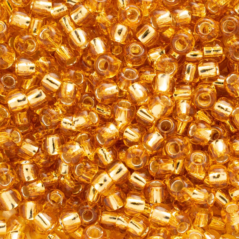 Toho Round Seed Beads Size 6/0 4mm, 22B Silver-Lined Medium Topaz