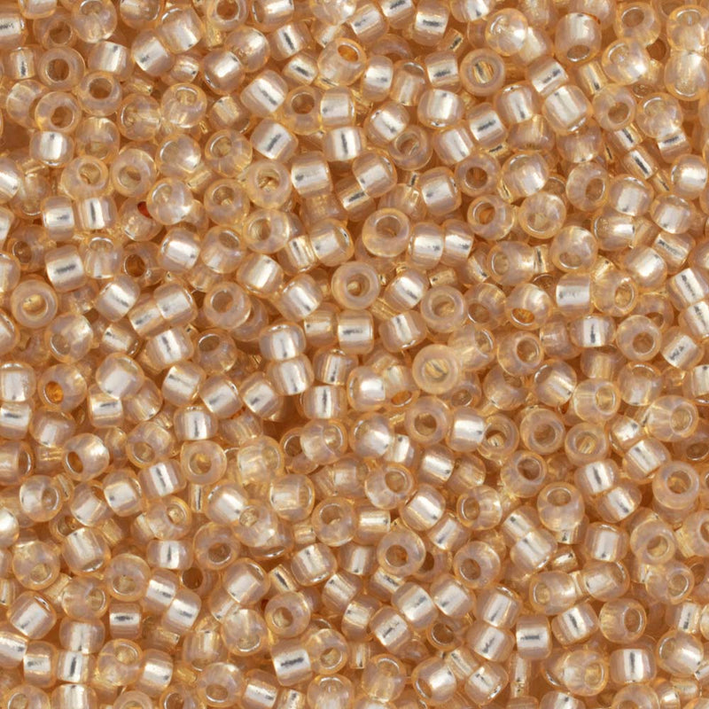 Toho Round Seed Beads Size 15/0 1.5mm, 2110 Silver-Lined Milky Light Topaz